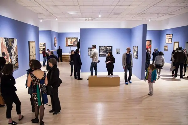 Visitors looking a studio exhibit at the Bronx Museum of