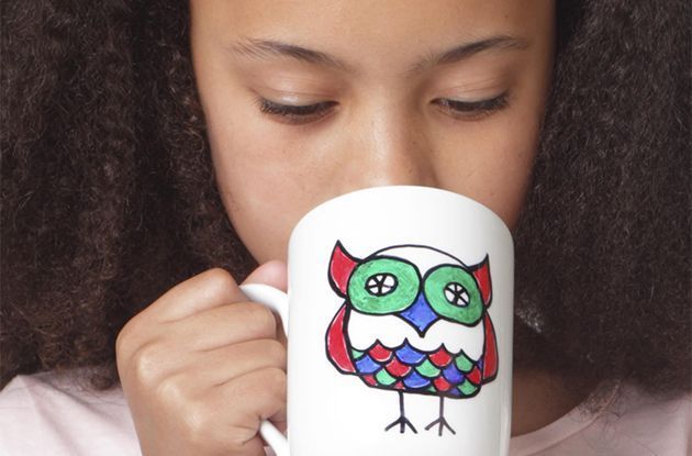 girl drinking from mug