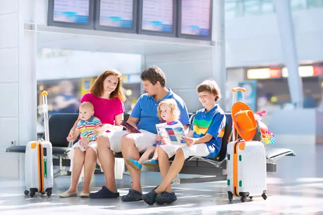 family traveling in airport