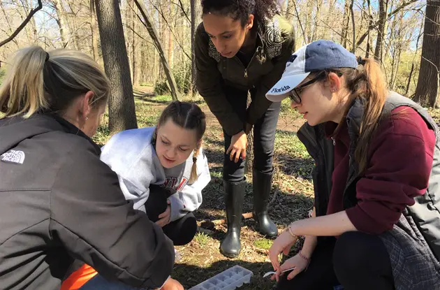 AHA Students Release Trout Raised in Classroom Into River