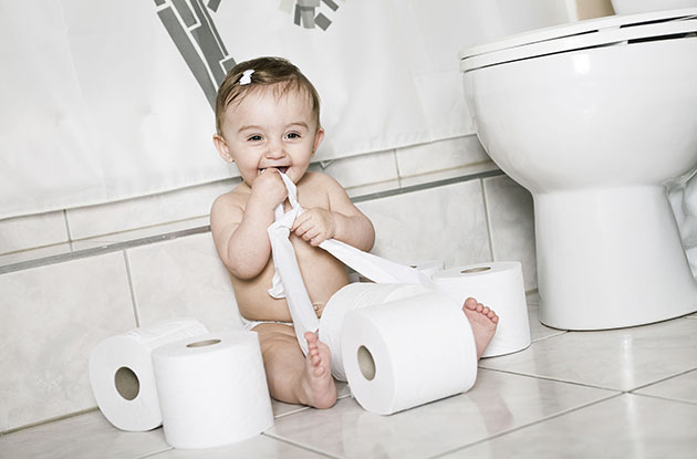 baby eating toilet paper