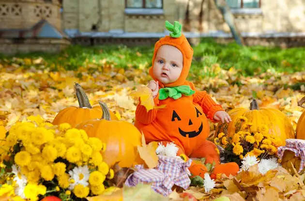 baby dressed as pumpkin