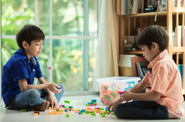 boys playing legos