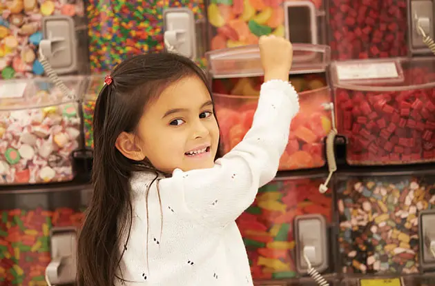 girl choosing candy