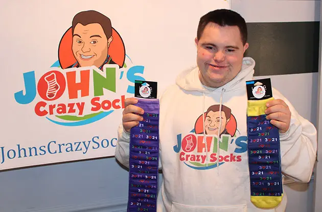 Young Man With Special Needs Celebrates Booming Sock Business
