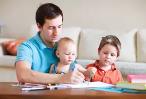 dad with children; father with two young children, drawing, at home