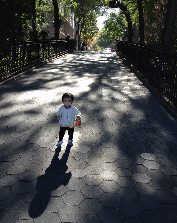 toddler walking in shadows