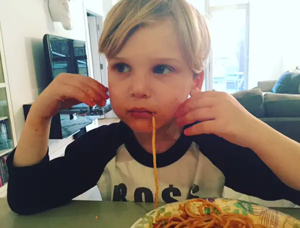 boy eating spaghetti