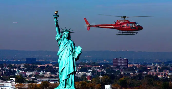 Liberty Helicopter flying over the Statue of Liberty