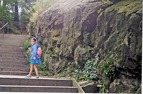 girl on park stairs