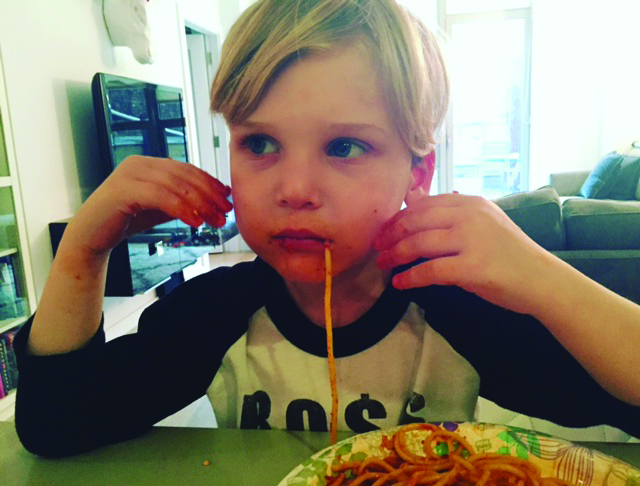kid eating spaghetti