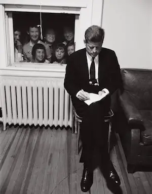 Kennedy draws audience preparing speech 1960
