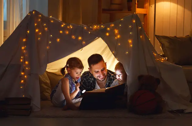 family reading in fort