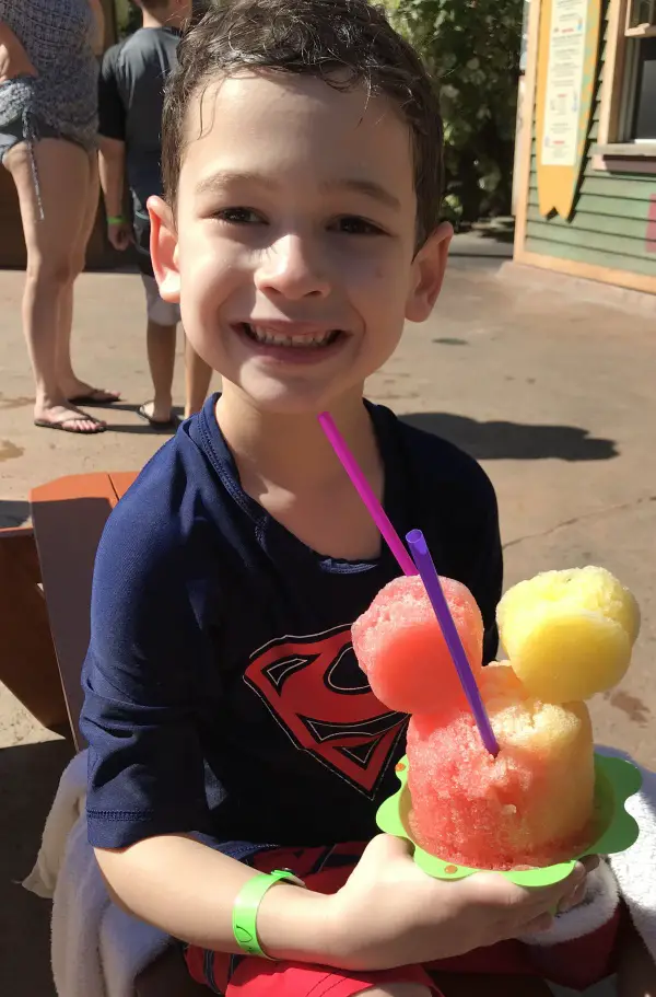 boy eating mickey shave ice