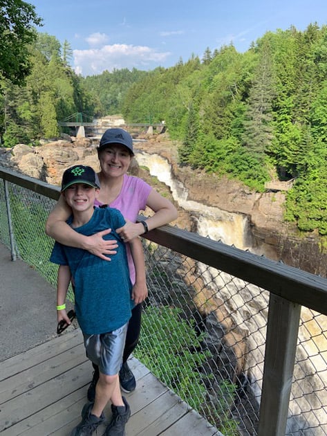 mother and son at canyon sainte-anne in quebec city cananda