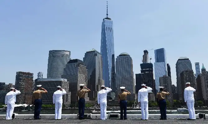 military services members saluting one world trade during fleet week nyc