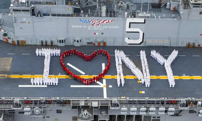 fleet week service members spelling out i heart ny