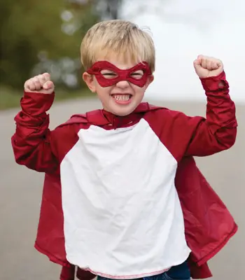 little boy dressed as superhero
