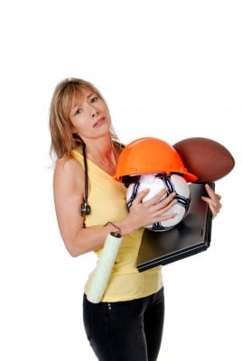 stressed mom holding football soccerball and laptop