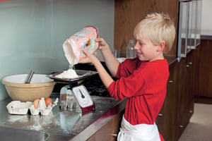 boy cooking pancakes