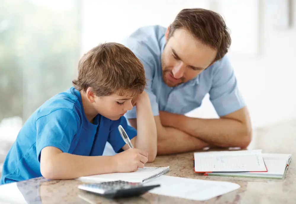dad helping son with learning disability with homework