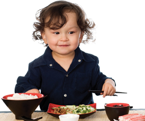 child eating Asian food