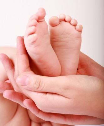 holding baby feet