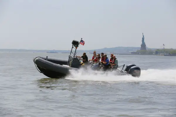 new york media boat statue of liberty