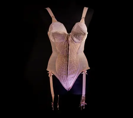 Jean Paul Gaultier (French, b. 1952). Corset-style body suit with garters, 1990, Duchess satin. Worn by Madonna during the “Metropolis” (“Express Yourself”) sequence of the Blond Ambition World Tour (1990). Collection of Madonna, New York. Photo: The Montreal Museum of Fine Arts, Christine Guest