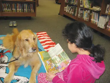 child reading to dog