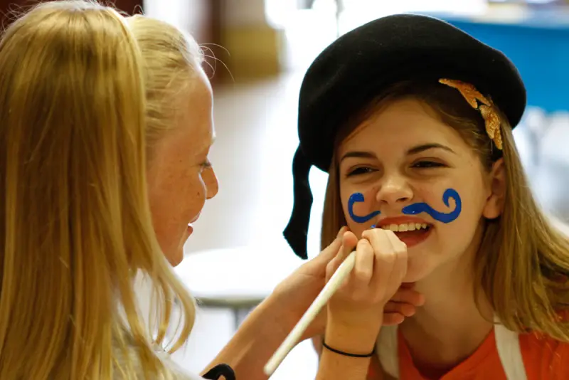 girl face painting mustache
