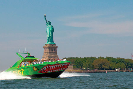 Circle Line 42's The Beast Speedboat rushes past the Statue of Liberty